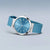 Bering Damenuhr mit blauem Silikonarmband, silbernem Gehäuse und blauem Zifferblatt