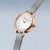 Bering Damenuhr mit roségoldener Lünette, hellem Zifferblatt und Milanaise-Armband