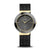 Damen-Armbanduhr mit rundem Zifferblatt und goldfarbenen Zeigern, dunkles Mesh-Armband, Keramikgehäuse.