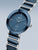 Bering Keramik-Armbanduhr mit blauem Zifferblatt, silbernen Zeigern und blauem Gliederarmband