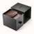 Uhrenbox mit schwarzem Deckel und braunem Lederfach