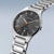 Herrenuhr mit schwarzem Zifferblatt, Titanarmband und orangefarbener Mittelakzentanzeige