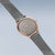 Damenuhr mit Roségold-Lünette, dunklem Zifferblatt und Milanaise-Maschenarmband