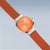 Bering Damenuhr am Handgelenklook: orangefarbenes Zifferblatt, orangefarbenes Milanaiseband