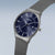 Herrenarmbanduhr grau mit dunkelblauem Zifferblatt, Zeitanzeige und seitlicher Krone