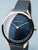 Damenarmbanduhr Bering mit rundem blauem Zifferblatt und blauem Metallarmband