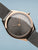 Bering Damen-Armbanduhr mit roségoldener Lünette, grauem Ziffernblatt und Milanaiseband