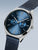 Bering Armbanduhr mit blauem Zifferblatt und drei Zählern sowie blauem Metall-Meshband