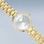 Damenuhr: weißes Zifferblatt, goldene Zeiger und Diamant-Aufdruck