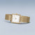 Bering Damenuhr: eckiges goldfarbenes Gehäuse mit weißem Zifferblatt und Milanaise-Armband