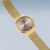 Bering Damenuhr roségold: rundes Gehäuse am Milanaise-Armband, hellrosa Zifferblatt