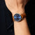 Bering Herrenuhr am Handgelenk mit blauem Zifferblatt und braunem Lederarmband