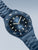 Bering Herrenarmbanduhr mit blauem Zifferblatt, markierter Lünette und Metallarmband