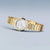 Damenuhr mit goldfarbenem Metallarmband und rundem Perlmutt-Zifferblatt