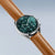 Bering Herrenuhr seitlich: grünes Zifferblatt, braunes Kalbslederarmband