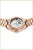 "Damklocka med roséguldpläterat metallarmband, genomskinlig bakboett och synligt urverk"