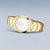 Damenuhr Bering Solar mit rundem goldfarbenem Zifferblatt und Metallarmband, römische Ziffern