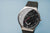 Herrenarmbanduhr mit schwarzem Zifferblatt und Chronographen-Subzifferblättern, Milanaiseband