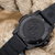 Herrklocka med svart Carbonox-armband och genomskinlig baksida med Navy Seal-logotyp