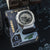 G-SHOCK GM-2100 Uhr auf Karte: silbernes Metallgehäuse, schwarzes Armband