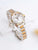Damenarmbanduhr bicolor mit Diamantlünette, Edelstahlband und Roségoldstreifen, Champagnerzifferblatt