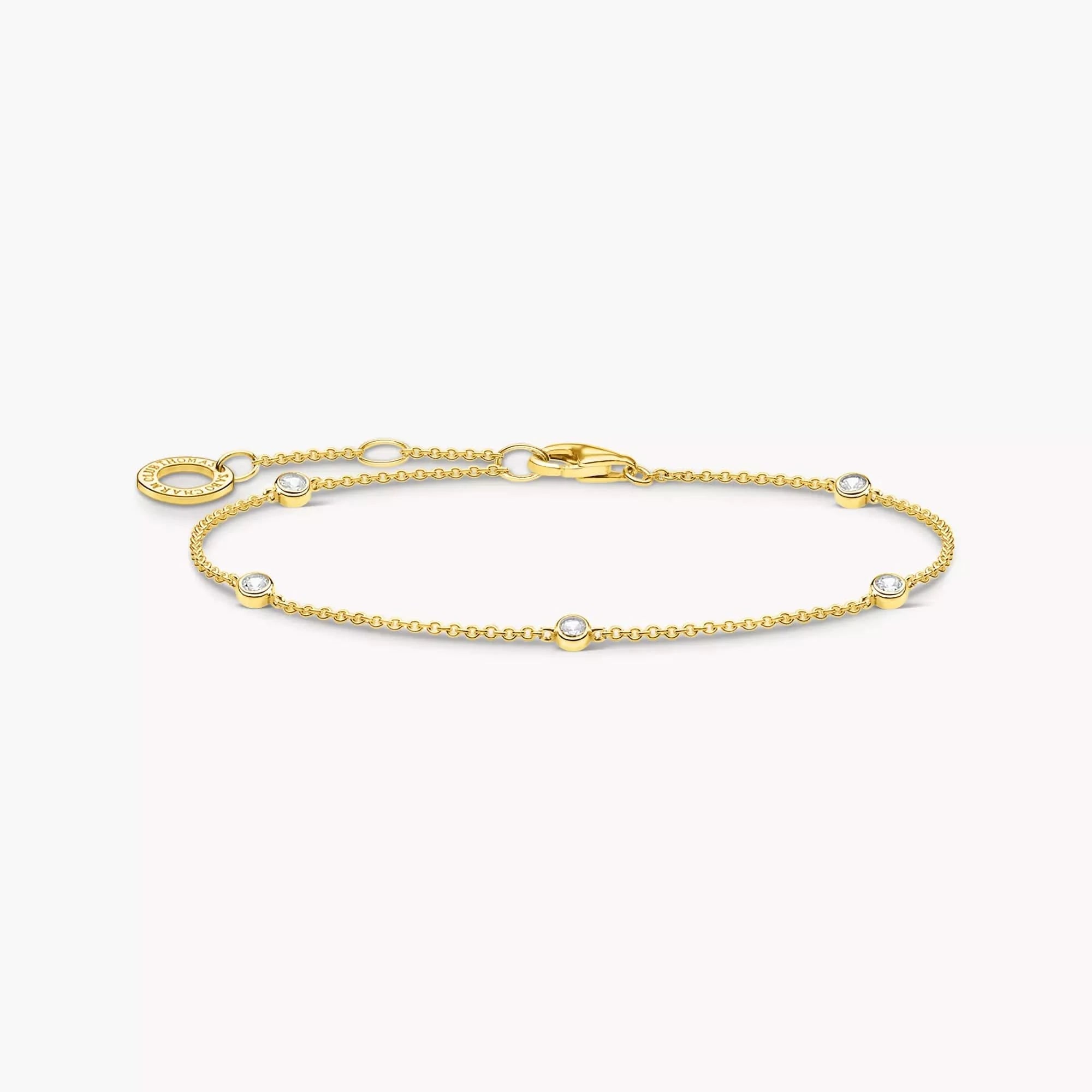 Guldpläterat armband med vita stenar och ovala länkar