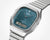 Casio AQ-240E-3AEF: silberne Armbanduhr mit türkisfarbenem Zifferblatt und Digitalzeit unten