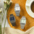 Casio Uhren auf Holz: blaues und helles Zifferblatt mit silbernem Metallband