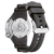 Herrklocka, bakvy, med svart gummiarmband och silverfärgad boett.