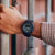 Casio G-Shock herrklocka på handleden, svart armband, gröna siffror
