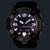 Herrenuhr mit schwarzem Gehäuse, rundem Display mit leuchtenden Ziffern, G-SHOCK Schriftzug.