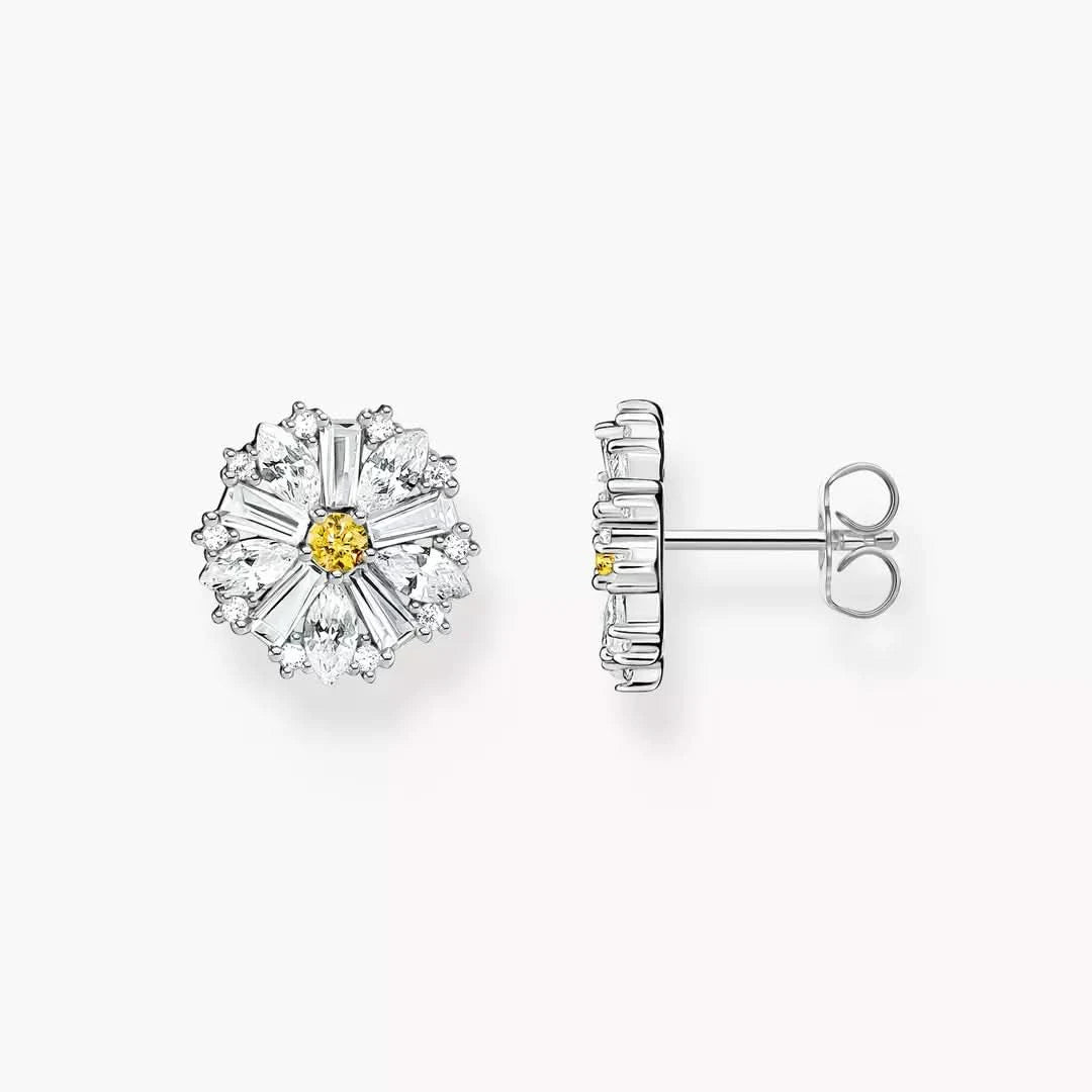 Örhängen i silver, blomma med gul mitt och gnistrande stenar
