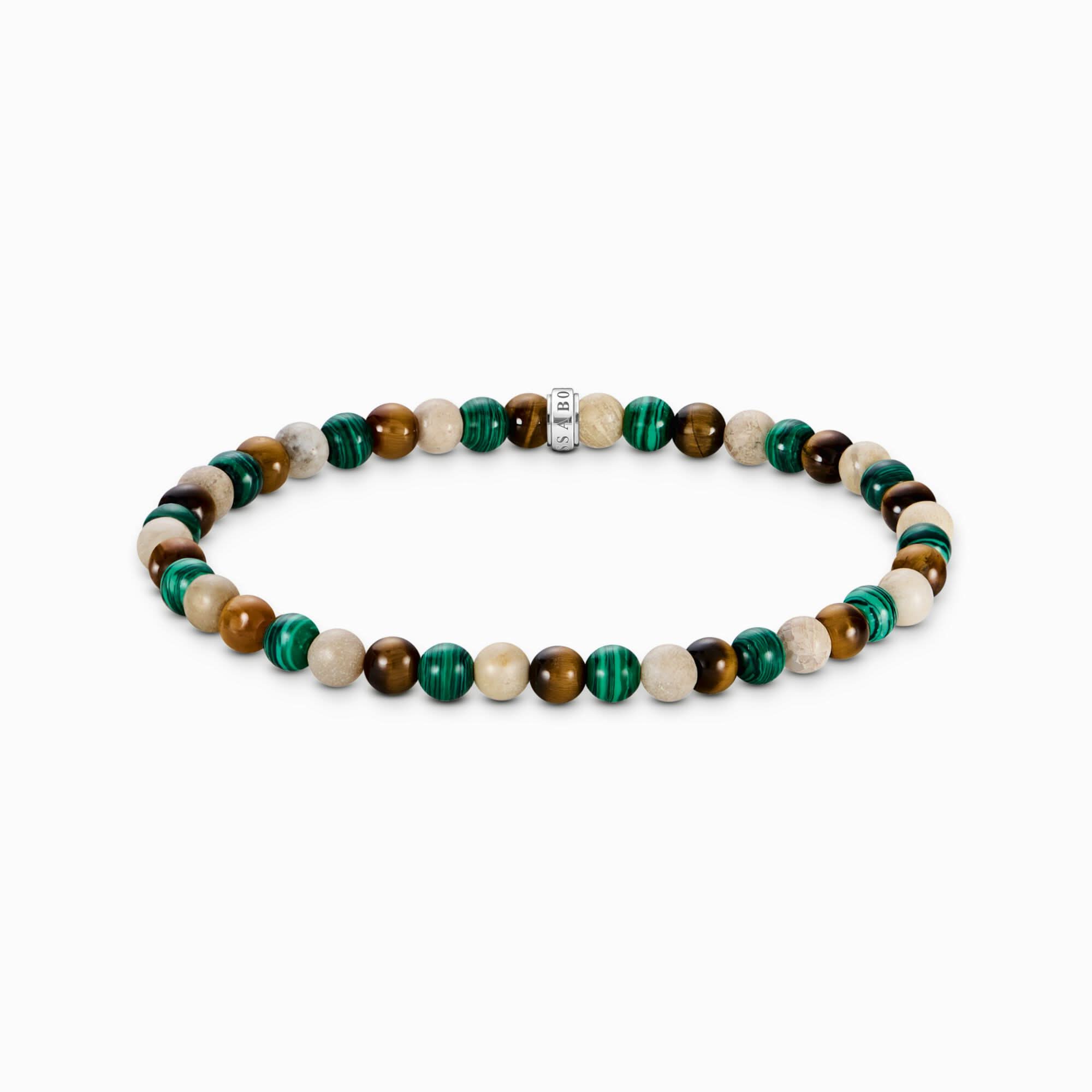Armband med pärlor av grön och brun sten med silverfärgat mellanlägg