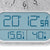 Digital display of the wall clock with temperature and humidity values on the blue display