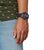 Casio G-Shock herrklocka på handleden, svart band och mörk urtavla