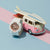 Casio Baby-G damklocka med vitt armband och orange urtavla