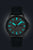 Herrenuhr mit schwarzem Zifferblatt, türkisfarbenen Leuchtmarkierungen, Lederband, Automatik