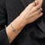 Armband med berlock i rostfritt stål, zirkoniastenar och svart segment