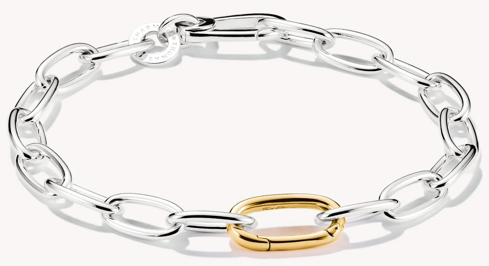Gliederarmband med silverfärgade länkar och guldfärgad Connect Link, Thomas Sabo
