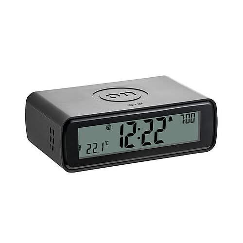 Retro-väckarklocka med fällbar sifferdisplay, rektangulärt hölje i mörkgrått/svart, aktiv display.