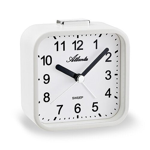 Väckarklocka med vitt hölje, svart urtavla och visare, analog timvisning