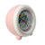 Barnväckarklocka i sidovy, rosa/vitt hölje med rund urtavla i detalj.
