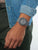 Casio G-Shock herrklocka på handleden, grått band och runt skyddande hölje