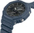 Casio G-Shock herrklocka, blå boett med krona och knappar, närbild