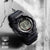 G-Shock herrklocka med digital display, svart boett med texten "Shock Resist"