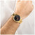 BOSS Herrenuhr am Handgelenk mit goldenem Edelstahlarmband und schwarzem Zifferblatt