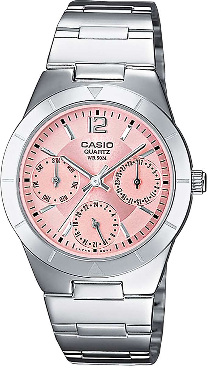 Casio damklocka med silverfärgat metallarmband och rund urtavla med rosa detaljer