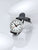 Herrklocka med svart läderband, boett i silver och vit urtavla