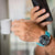 Festina Connected herrklocka på handleden, turkosfärgat armband med svart urtavla.