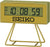 Digital Seiko-väckarklocka, guldfärgad boett i resin, gul display, stativ